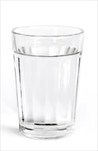 Fresh cold water in a glass with white background