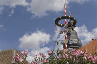 Turrets with decorative flags and flowers, festive atmosphere under a blue sky, speyer, germany
