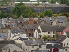 View of a town with various roofs and buildings surrounded by trees, Inverness, Scotland, United