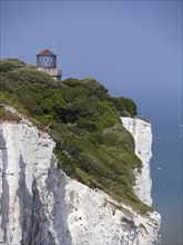 Dover chalk cliffs with lighthouse