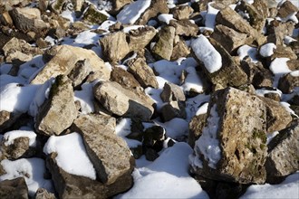 Snow stones, stones with snow, background and afterimage