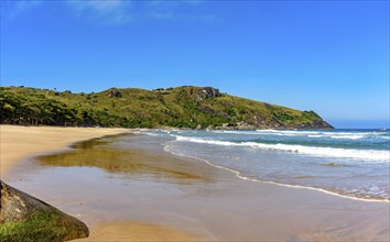 Image of Bonete beach on the island of Ilhabela with the hills and forest around it, Bonete beach,