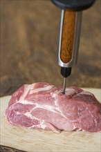 Injecting marinade into pork meat