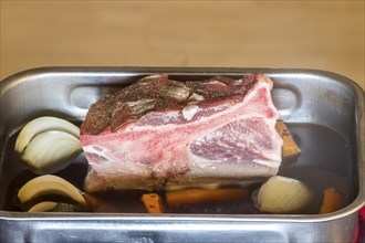 Raw pork shoulder in a casserole