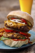 Home made cheeseburger on wood