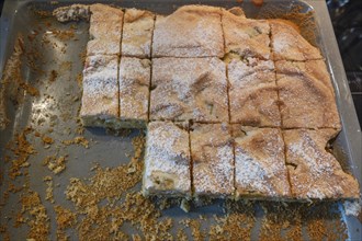 Freshly sliced covered apple pie on a baking tray, Bavaria, Germany, Europe