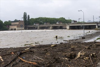 Symbolic image extreme weather, global warming, climate change, floods, alluvial wood, barrage on