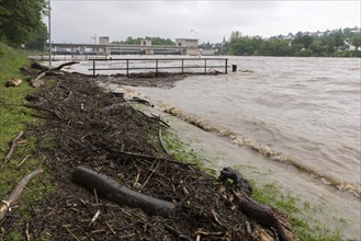 Symbolic image extreme weather, global warming, climate change, flood, washed up wood, barrage on