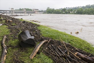 Symbolic image extreme weather, global warming, climate change, flood, washed up wood, barrage on