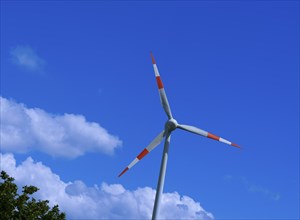 Wind turbine in front of a blue sky with clouds, Teutschenthal, Saxony, Germany, Europe