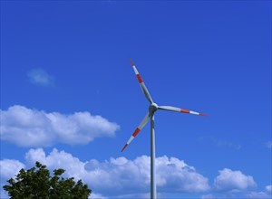 Wind turbine in front of a blue sky with clouds, Teutschenthal, Saxony, Germany, Europe