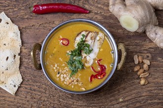 Indian mulligatawny soup in a brass bowl