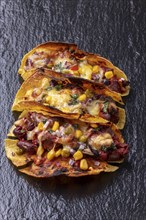 Gratinated tacos on slate