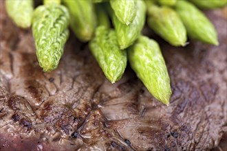 Wild asparagus on steak