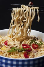 Closeup of ramen with chopsticks