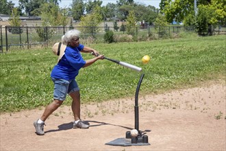 Detroit, Michigan, Fanella Felto, 73, competes in the Softball Hit at the Detroit Senior Olympics.