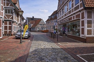 Street Bürgerei, small cobblestone shopping street in the centre of Jork, Altes Land, district of