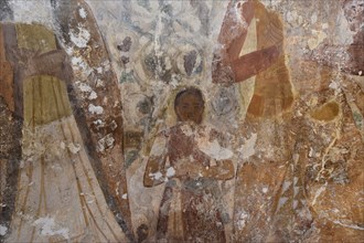 Close-up of old frescoes with religious figures and faded colours, child, Byzantine chapel Agios