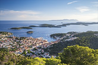 View of the old town centre of Hvar, behind Pakleni or Paklinski Islands, Dalmatia, Croatia, Europe