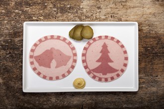 Sausage slices with tree shapes