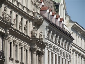 Detailed white façade of a historic baroque building with statues and ornaments, Vienna, Austria,