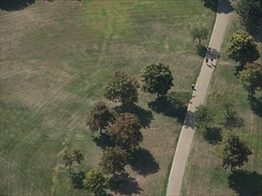 Aerial view of a park with trees and a walking path through a peaceful landscape, Vienna, Austria,