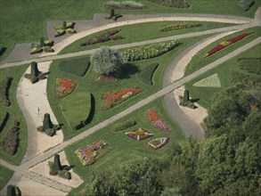 Symmetrically laid out park with numerous flowerbeds and green paths, Vienna, Austria, Europe