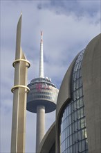 Minaret of the DITIB central mosque in Cologne Ehrenfeld, behind it the television tower, Cologne,