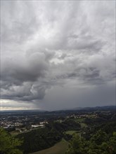 Storm clouds over Leibnitz, Seggau Castle, Frauenberg pilgrimage church in the background, view