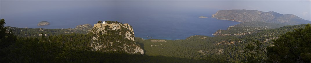 Panoramic view of a wooded coastal landscape with castle ruins and islands, Kastro Monolithou,