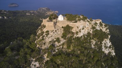 Aerial view of a castle on a wooded cliff on the coast, Kastro Monolithou, castle Monolithos, rock