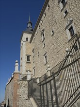 Castle wall with stairs and towers under a blue sky, Toledo, Spain, Europe