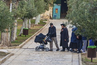 A group of Israeli Jews visiting the temple Mount despite official rabbinic ban on setting foot on