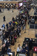 Interior of Willy Brandt International airport, people standing in line