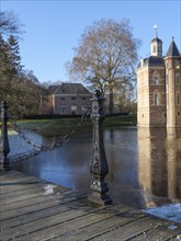 Beautiful castle with moat, bridge and close-up of a wooden footbridge with chains, ruurlo,