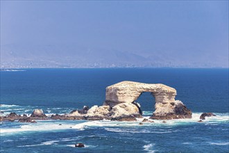 The famous natural landmark La Portada Rock Formation