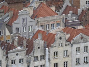 View of the roofs and facades of several historic buildings in an old town, Gdansk, Poland, Europe