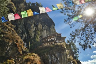 View of Taktshang Monastery through prayer flags