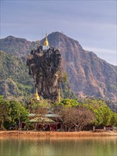 Amazing Buddhist Kyauk Kalap Pagoda under afternoon sky