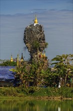 Amazing Buddhist Kyauk Kalap Pagoda under afternoon sky