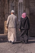 Two arabic looking men walking in Jerusalem