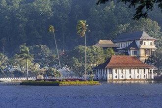 Temple of the Sacred Tooth Relic with it's lake in the foreground