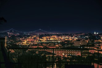 Lisbon at night with the iron bridge in the background