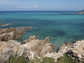 Rocky coastline with clear turquoise water and lush nature, ajaccio, corsica, france