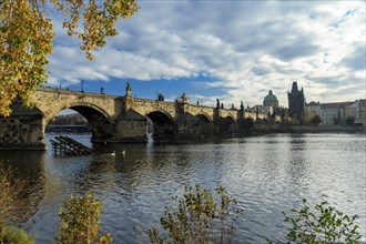 Charles Bridge in Prague on a beautiful autumn day