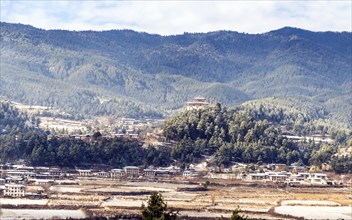 Some snow over the city of Bumthang in Bhutan