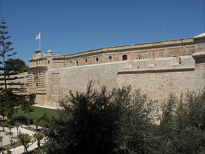 Close-up of stone fortress walls under a clear blue sky, mdina, mediterranean sea, Malta, Europe