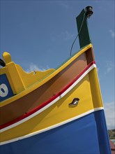 Colourful tip of a boat with one eye pointing to the sky, marsaxlokk, mediterranean sea, malta