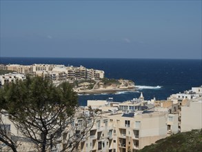 Coastal town with many buildings and views of the sea, gozo, mediterranean sea, malta