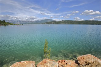 Stones on the shore of the reservoir Lac de Sainte-Croix near Sainte-Croix-du-Verdon, landscape,